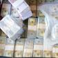 Fake dollars confiscated by DCI in Tuesday morning raid (Twitter)