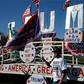 A man poses in front of a Trump sign as he waits to see US Republican Presidential nominee Donald Trump address supporters on November 6, 2016 in Sterling Heights, Michigan