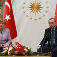 Turkish President Recep Tayyip Erdogan (R) listens on as German Chancellor Angela Merkel speaks during their meeting at the Presidential Palace in Ankara on February 2, 2017