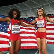 Sydney McLaughlin and Brandee Johnson of the USA celebrate with flags after the Girls 400 Meters Hurdles Final at a past Youth Championships.