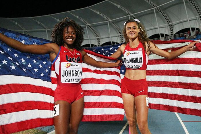 Sydney McLaughlin and Brandee Johnson of the USA celebrate with flags after the Girls 400 Meters Hurdles Final at a past Youth Championships.