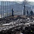 Prisoners build a new, second fence at the Hungarian-Serbian border near Gara village on October 27, 2016