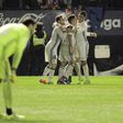 Real Madrid's players celebrate after the team's third goal against Osasuna at El Sadar stadium in Pamplona on February 11, 2017