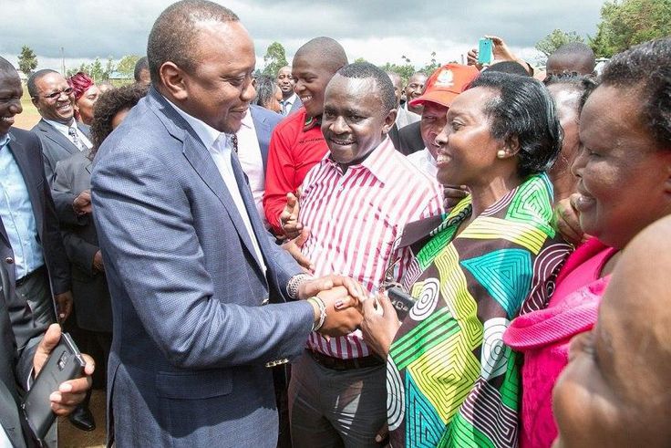 President Uhuru Kenyatta (left) is warmly received by Narc Kenya leader Martha Karua during his tour of Kirinyaga County.