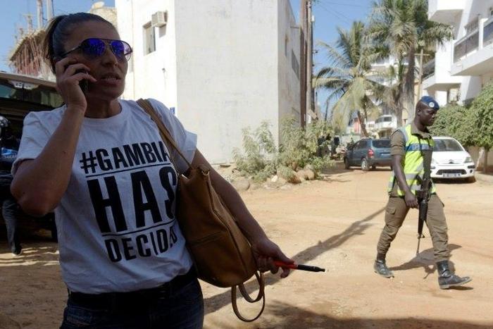 A supporter of Gambia's president-elect Adama Barrow pictured outside of the Gambian Embassy in Senegal's capital Dakar on January 19, 2017, ahead of Barrow's inauguration