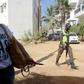 A supporter of Gambia's president-elect Adama Barrow pictured outside of the Gambian Embassy in Senegal's capital Dakar on January 19, 2017, ahead of Barrow's inauguration