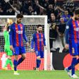 Barcelona's Lionel Messi (C) and teammates look dejected at the end of their UEFA Champions League match against Juventus, at the Juventus stadium in Turin, on April 11, 2017