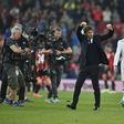 Chelsea's Italian head coach Antonio Conte celebrates at the end of the English Premier League football match between Bournemouth and Chelsea at the Vitality Stadium in Bournemouth, southern England on April 8, 2017