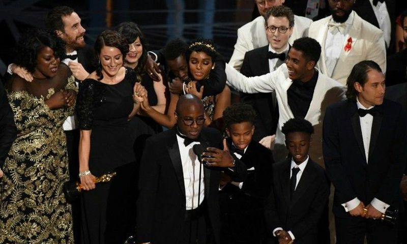 US director Barry Jenkins (C) speaks after "Moonlight" won the Best Film award at the 89th Oscars on February 26, 2017 in Hollywood, California