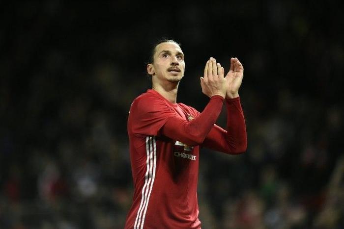 Manchester United's Swedish striker Zlatan Ibrahimovic applauds supporters after the English Football League Cup fourth round match between Manchester United and Manchester City on October 26, 2016