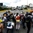 Opposition activists and riot police face off during a protest against President Nicolas Maduro, in Caracas, on May 8, 2017