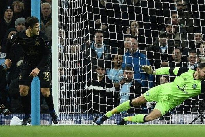 Celtic's goalkeeper Craig Gordon dives to make a save during an UEFA Champions League match in Manchester, in December 2016