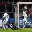 Leverkusen's midfielder Hakan Calhanoglu scores 3:1 during the German first division Bundesliga football match of Bayer Leverkusen vs Hertha BSC Berlin in Leverkusen, western Germany, on January 22, 2017