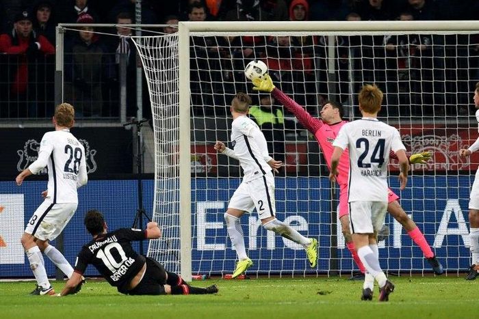 Leverkusen's midfielder Hakan Calhanoglu scores 3:1 during the German first division Bundesliga football match of Bayer Leverkusen vs Hertha BSC Berlin in Leverkusen, western Germany, on January 22, 2017