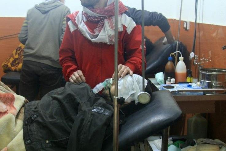 A picture shows people being treated at a field hospital after an alleged poison gas attack by troops loyal to President Bashar al-Assad in the rebel-held city of Daraya, southwest of the capital Damascus, on January 13, 2014