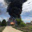 Black smoke billows after an explosion at a warehouse containing hazardous chemical waste near Madrid on May 4, 2017