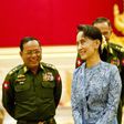 De facto leader Aung San Suu Kyi (C) faces dissent over the role of Myanmar's still powerful military, especially a bloody crackdown on Rohingya Muslims