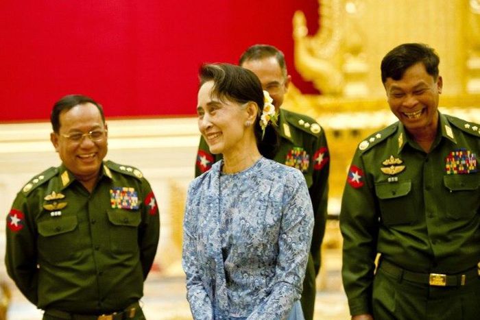 De facto leader Aung San Suu Kyi (C) faces dissent over the role of Myanmar's still powerful military, especially a bloody crackdown on Rohingya Muslims