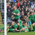 Lincoln City players celebrate after scoring against Premier League side Burnley in the fifth round of the FA Cup on February 18, 2017