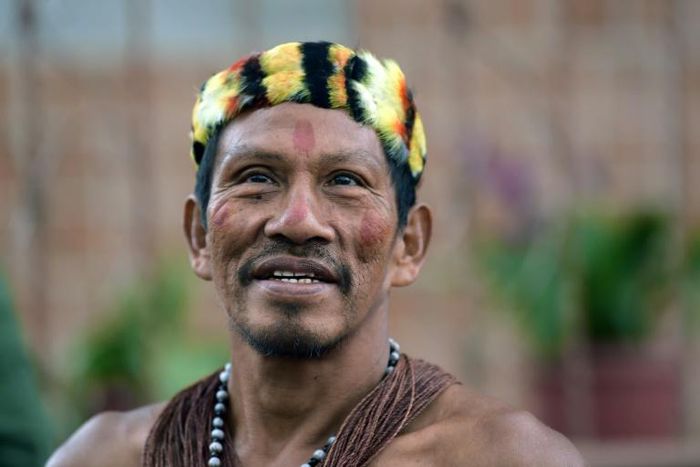 A Waorani indigenous man takes part in a march over oil exploration in his ancestral lands