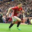 Manchester United's midfielder Ander Herrera runs to the corner to celebrate scoring their second goal during the English Premier League football match between Manchester United and Chelsea on April 16, 2017