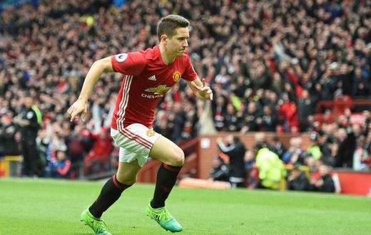 Manchester United's midfielder Ander Herrera runs to the corner to celebrate scoring their second goal during the English Premier League football match between Manchester United and Chelsea on April 16, 2017
