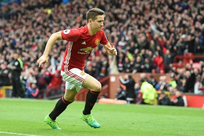 Manchester United's midfielder Ander Herrera runs to the corner to celebrate scoring their second goal during the English Premier League football match between Manchester United and Chelsea on April 16, 2017