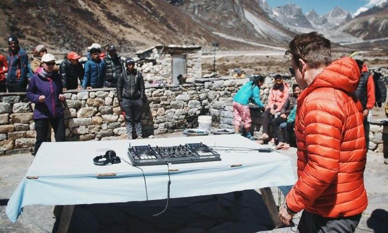 Influential British DJ Paul Oakenfold has reached Mount Everest's base camp where he plans to host the "highest party on earth", performing a set at 5,380 metres (17,600 feet)