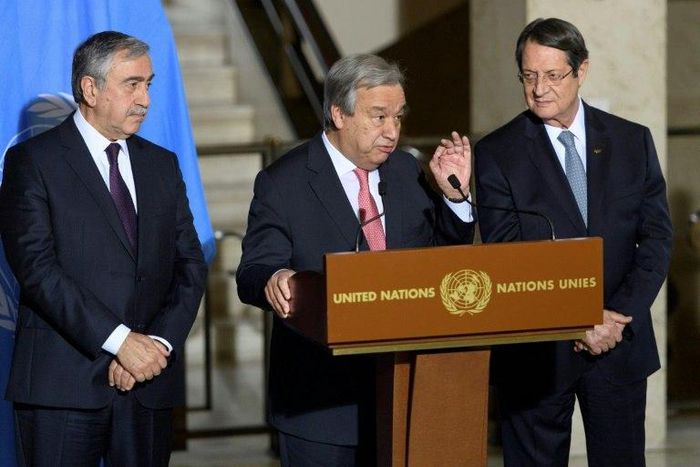 UN Secretary-General Antonio Guterres (C), pictured in January 2017, has arranged for rival Cypriot leaders, Turkish Mustafa Akinci (L) and Greek Cypriot President Nicos Anastasiades (R), to meet in New York this weekend
