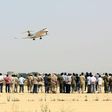A Libyan Airlines aircraft flies over Tripoli International Airport, after forces belonging to the Libyan unity government took control of the facility on June 1, 2017