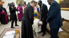 Pope Francis kneels to kiss the feet of South Sudan's President Salva Kiir