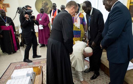 Pope Francis kneels to kiss the feet of South Sudan's President Salva Kiir