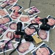 Pictures of journalists recently murdered in different Mexican states lay on the ground at Independence Angel square during a protest by journalists in Mexico City, on May 16, 2017