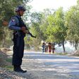 An armed Myanmar policeman stands guard on a road in northern Rakhine State from where tens of thousands of Rohingya have fled to Bangladesh to escape persecution