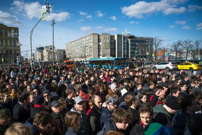 This photo taken on March 26, 2017 shows opposition supporters taking part in an unauthorised anti-corruption rally in central Moscow