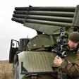 A Ukrainian serviceman aims a 122 mm MLRS BM-21 Grad during military exercises near Kiev on October 28, 2016