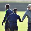 Arsenal manager Arsene Wenger (right) shakes hands with Chilean striker Alexis Sanchez during a training session in London Colney, on March 6, 2017