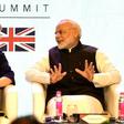 British Prime Minister Theresa May speaks with India's counterpart Narendra Modi as they attend The India-UK Tech Summit in New Delhi, on November 7, 2016