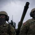 US army soldiers stand in front of US M1 Abrams tank during a joint military tactical training exercise Blowback 2016 with Bulgaria's army at Novo Selo military ground on April 11, 2016