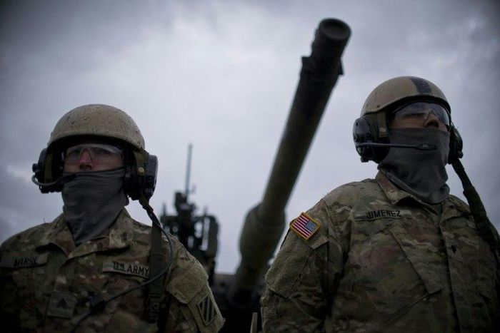 US army soldiers stand in front of US M1 Abrams tank during a joint military tactical training exercise Blowback 2016 with Bulgaria's army at Novo Selo military ground on April 11, 2016