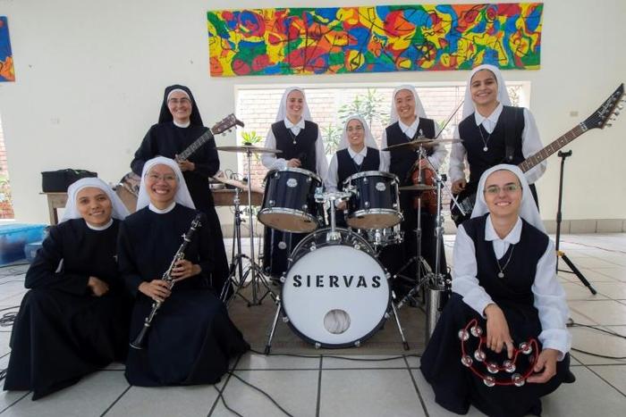 Known as "Siervas" or Servants, a band made up of nuns plays catchy Christian songs that sound indistinguishable from many of their peers in mainstream rock