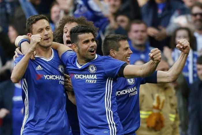 Chelsea's Nemanja Matic (L) celebrates with teammates after scoring a goal during their FA Cup semi-final match against Tottenham Hotspur, at Wembley stadium in London, on April 22, 2017