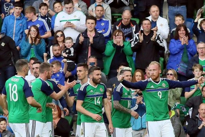 Northern Ireland's striker Liam Boyce (R) celebrates with teammates after scoring against New Zealand at the National Football Stadium at Windsor Park in Belfast on June 2, 2017