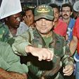 Panamanian dictator Manuel Noriega playfully fakes a punch to a supporter at the height of his power in 1989