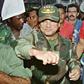 Panamanian dictator Manuel Noriega playfully fakes a punch to a supporter at the height of his power in 1989
