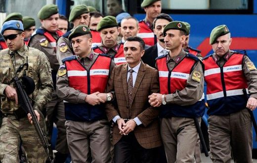 Security forces escorting suspects ahead of a hearing in Mugla where 47 people went on trial over alleged coup links earlier this month