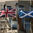 The British, Scottish and EU flags in front of the Scottish Parliament in Edinburgh