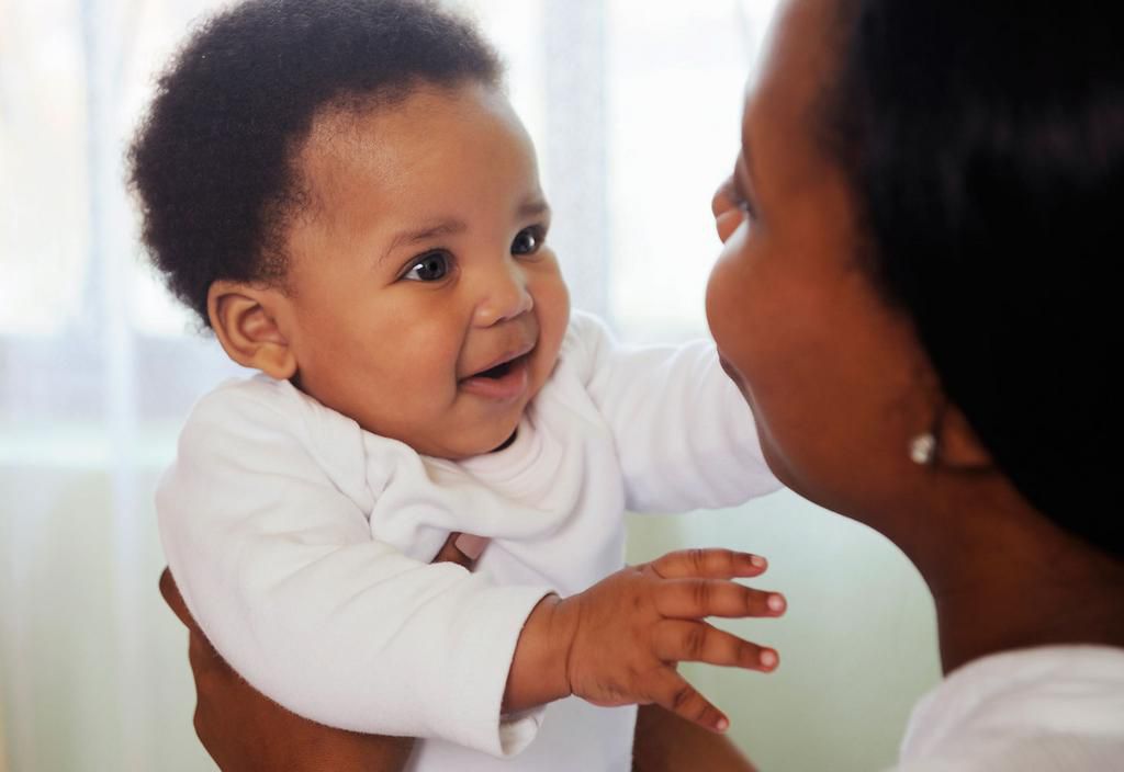 Mom holding baby(Time Magazine)