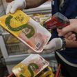 The staff of Rio de Janeiro state's consumer protection agency, PROCON, checks the temperature of frozen chicken products at a supermarket in Rio de Janeiro, Brazil, on March 24, 2017