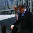 Costas Takkas (R), former secretary-general of the Cayman Islands Football Association seen leaving the Eastern District Court in Brooklyn, New York last year, pleaded guilty to Money laundering conspiracy in the sweeping FIFA corruption scandal